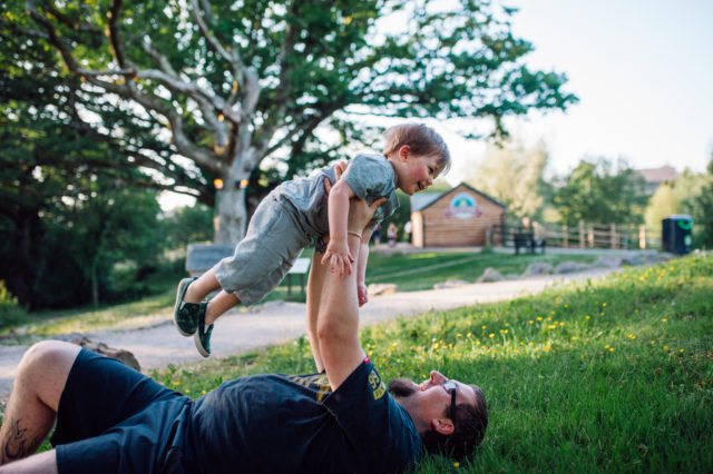 Father and son playing - family holiday Wales
