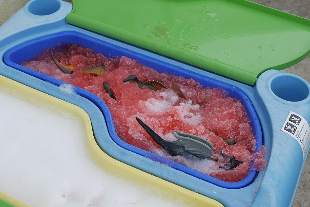 Dinosaur wash messy play set up