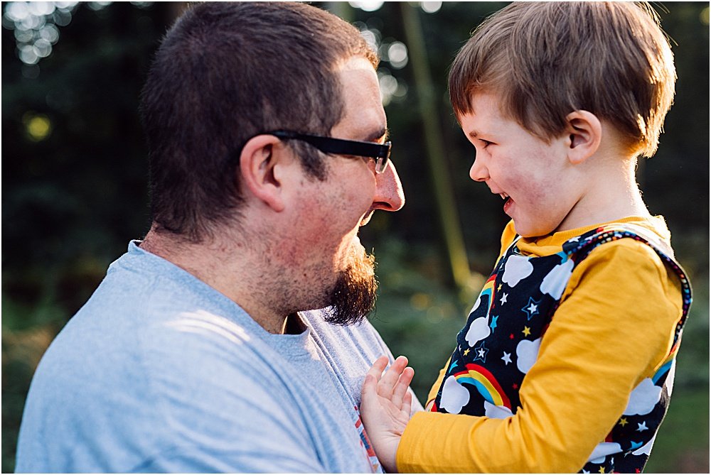 father and son laughing together 