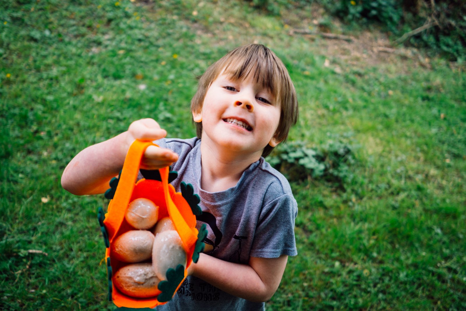 Child showing Easter egg basket 