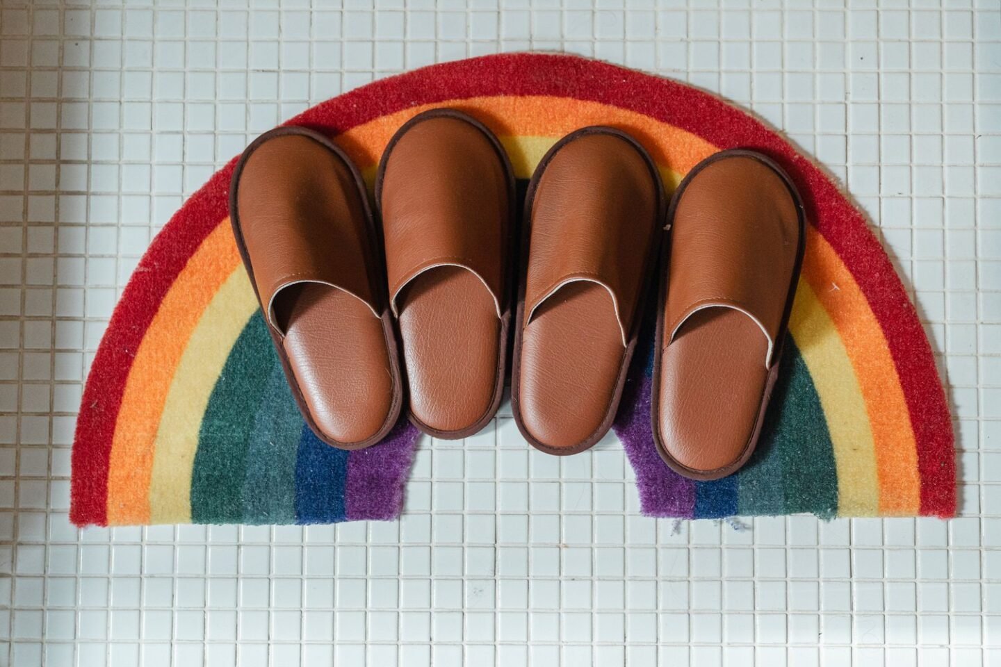 rainbow doormat with brown slippers