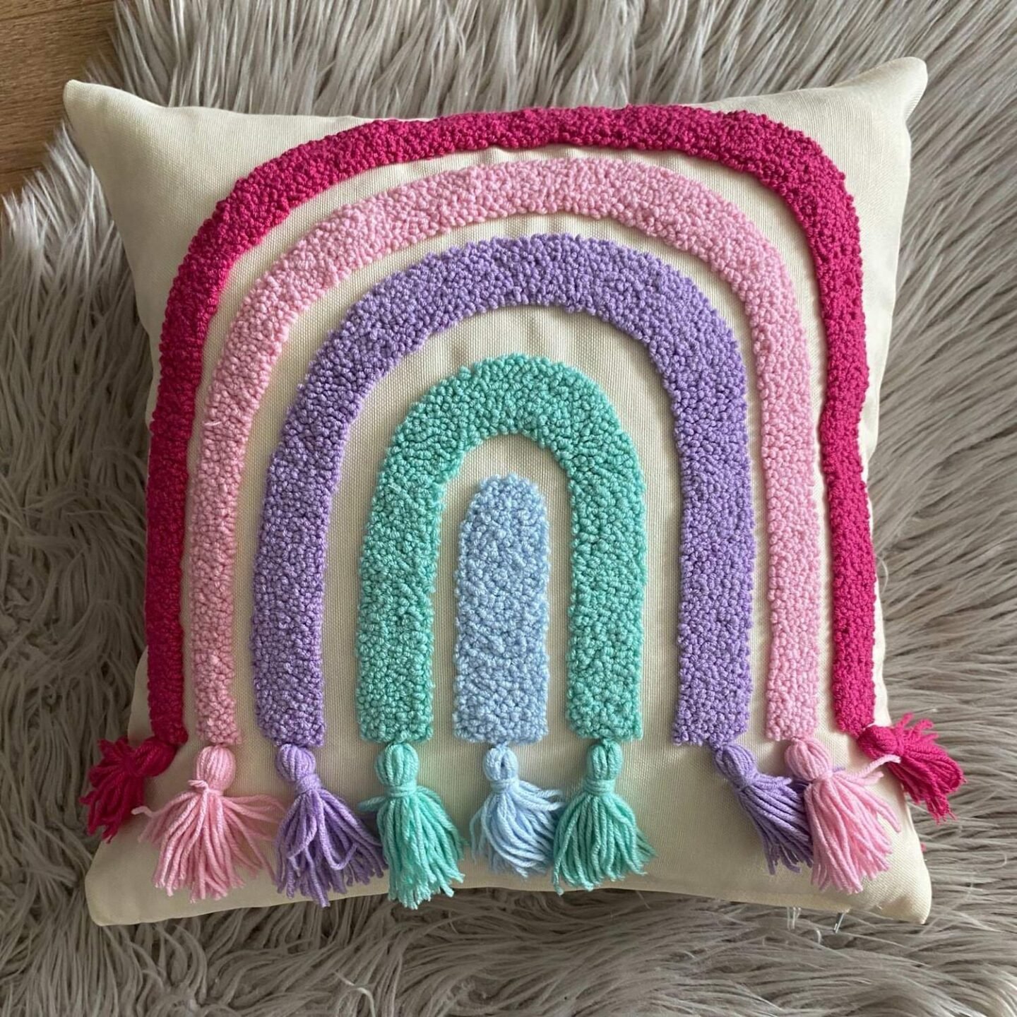 embroidered rainbow pillow