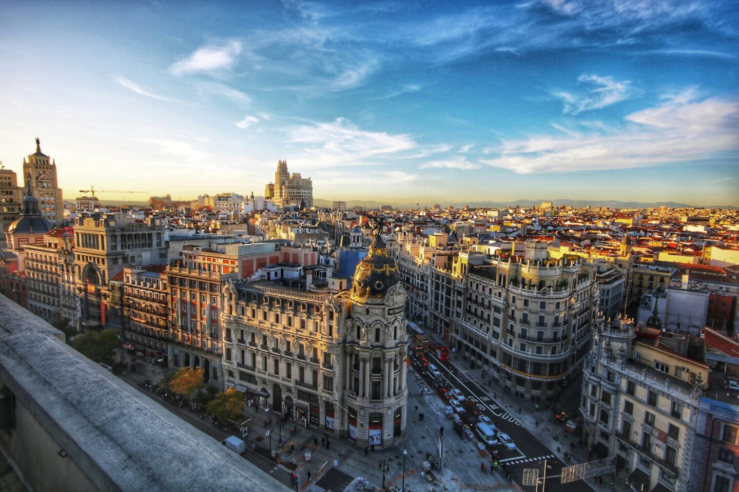 Sunlit Spanish cityscape under a clear blue sky